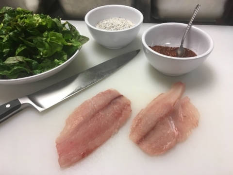 Fish being prepped in the kitchen