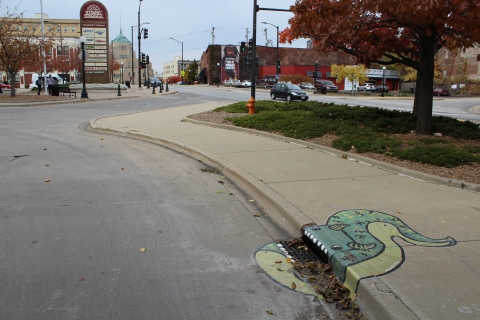 This picture shows the slug-like creature mural is located near the intersection of Chester St and University Ave