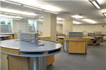 Several working lab benches in a large open room.