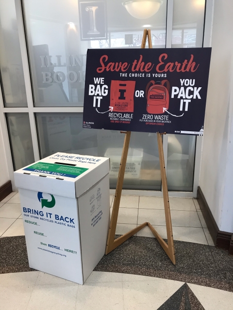 Plastic bag recycling sign and collection box at the Illini Union Bookstore entrance