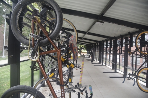 Bike Shelter in use - bicycles hanging on the side stage racks